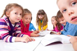 Group of children enjoying reading together